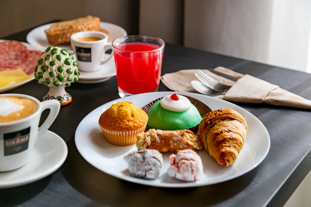 Breakfast featuring croissants, pastries, and beverages served at the Best Western Plus Fontana Falconieri in Messina